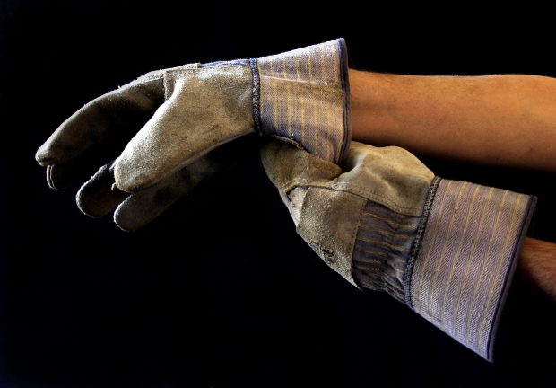 bigstock-Man-Putting-On-Work-Gloves-306080